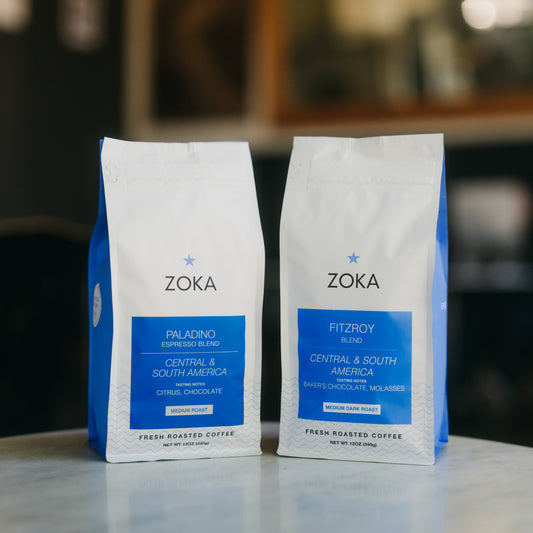 One 12 oz bag of Paladino blend and one 12 oz bag of Fitzroy blend on a table.